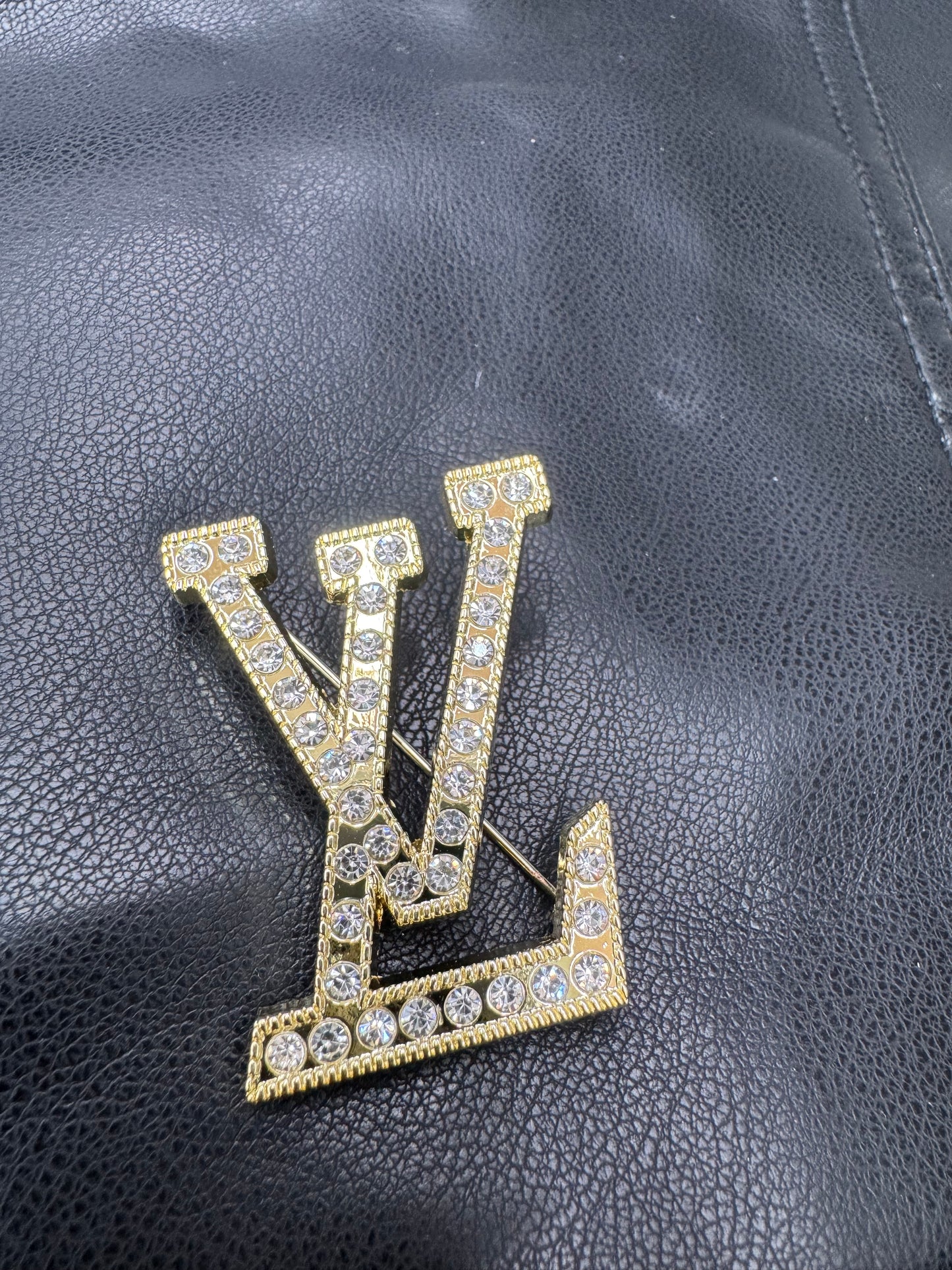 LV brooch