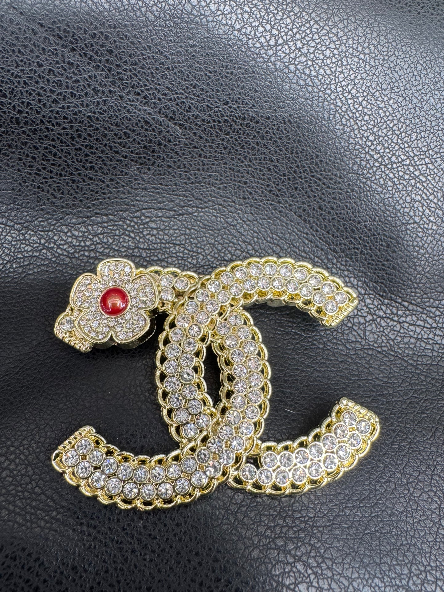 Cc brooch