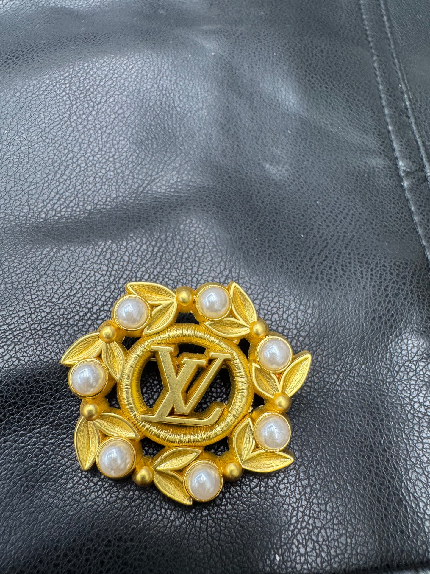 LV brooch