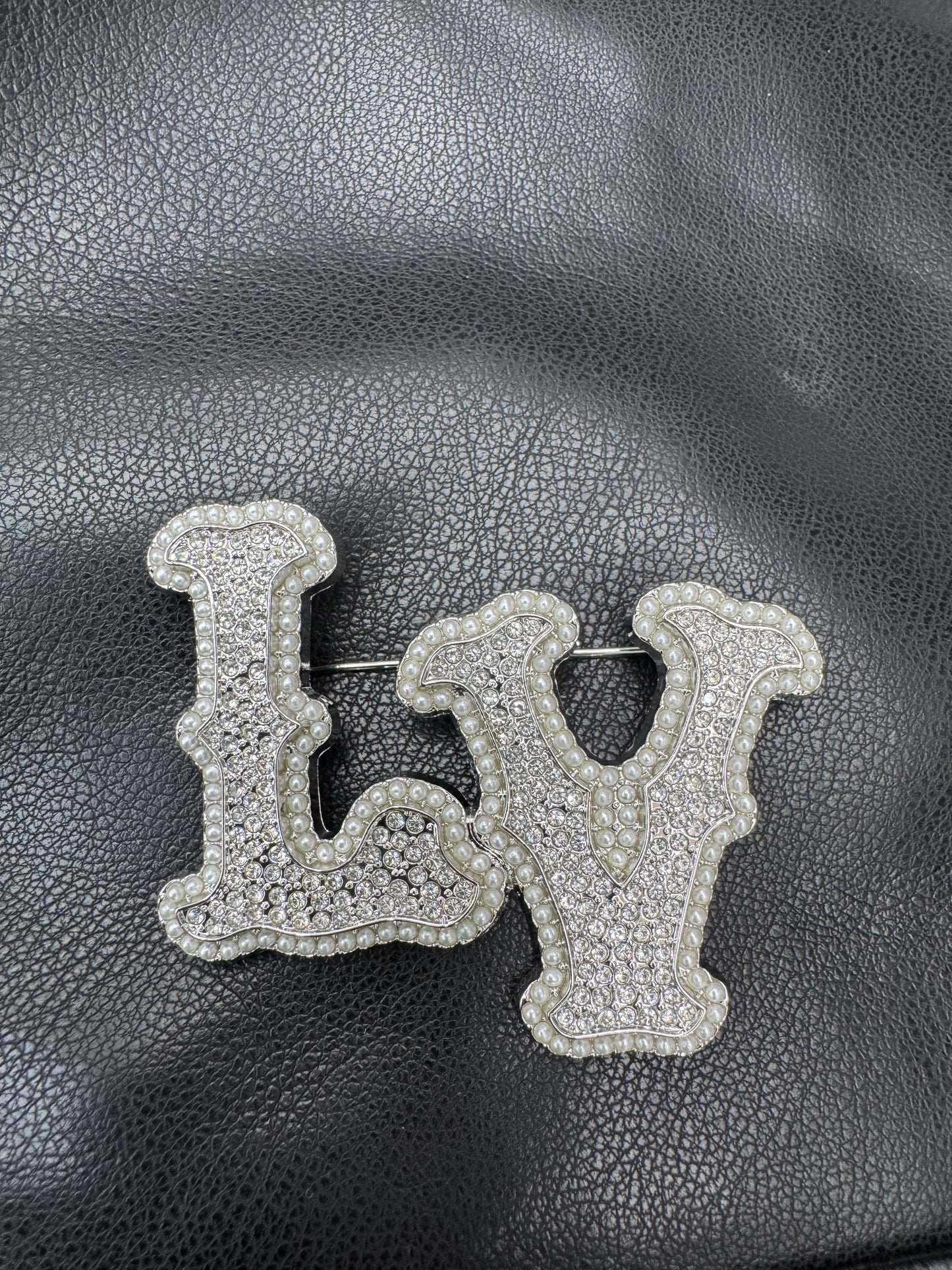 LV silver brooch