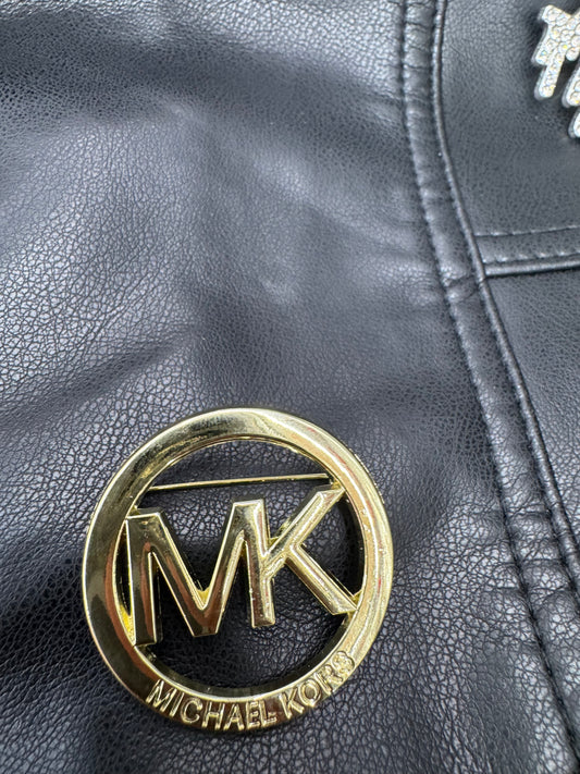 MK brooch
