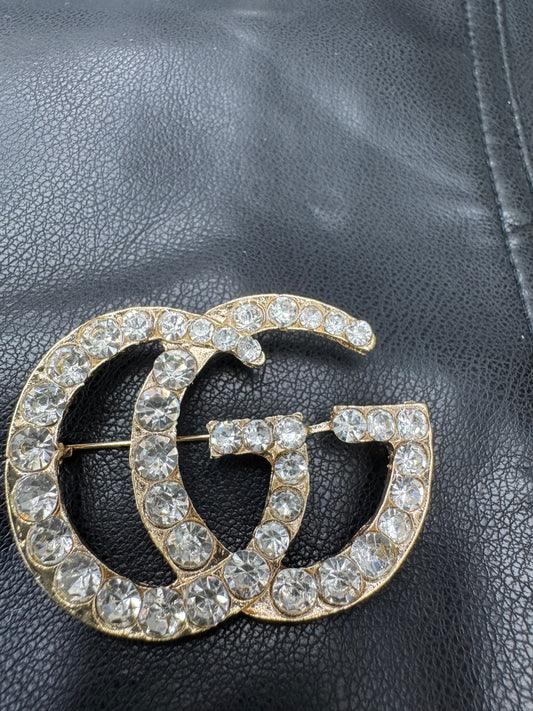 GG brooch