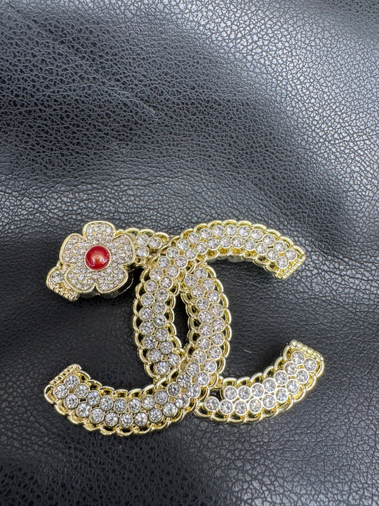 Cc brooch