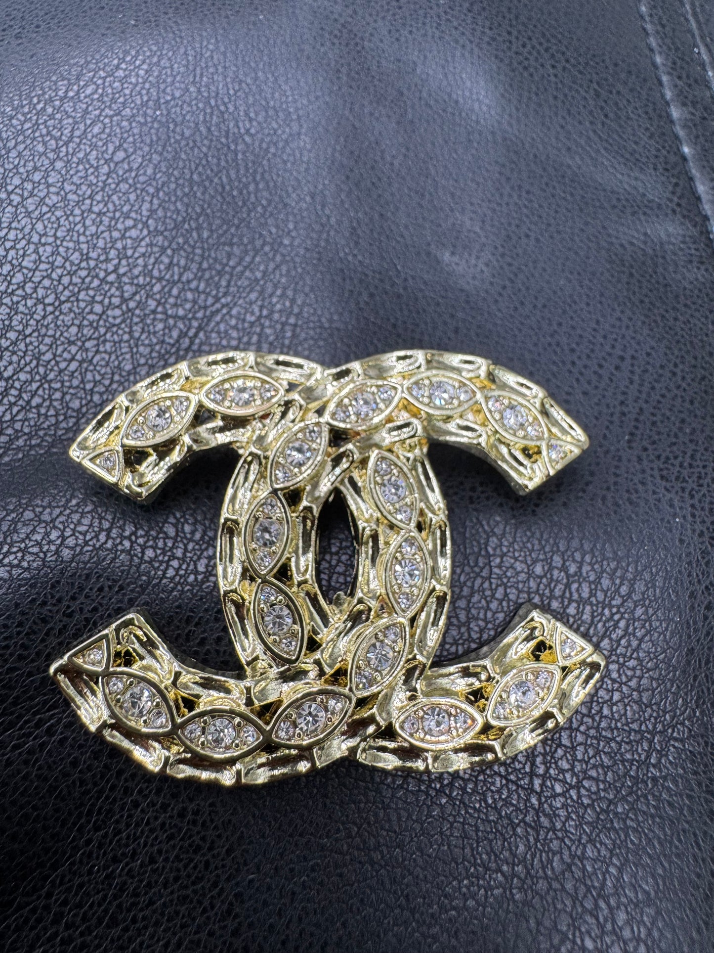 CC brooch