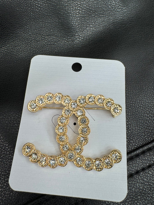 CC brooch