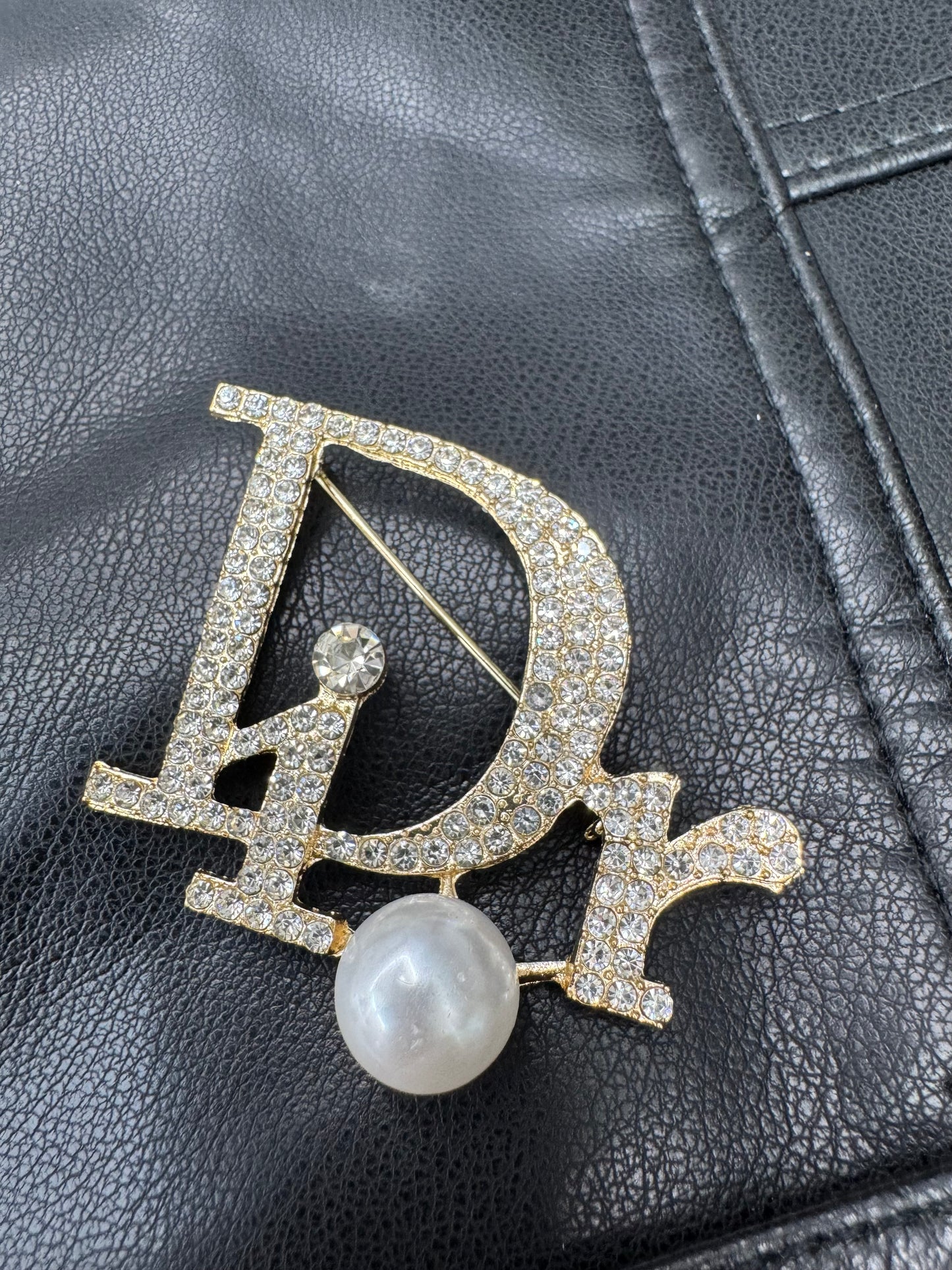 DIO.R Brooch