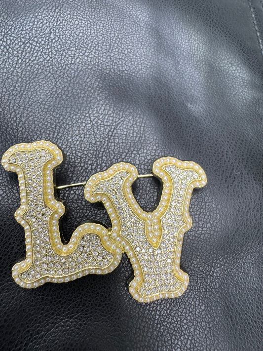 Gold LV brooch