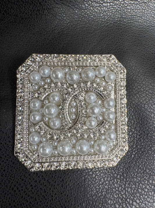 CC brooch
