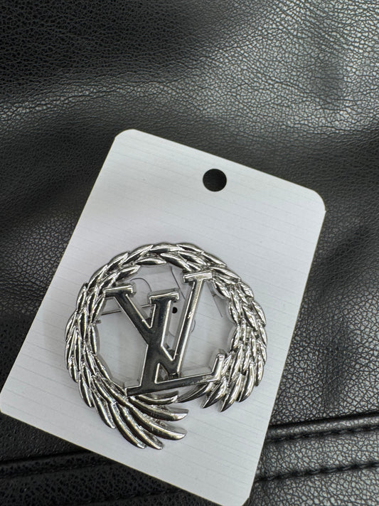 LV brooch