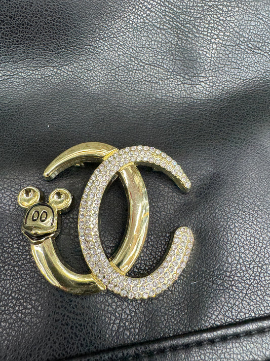 CC brooch