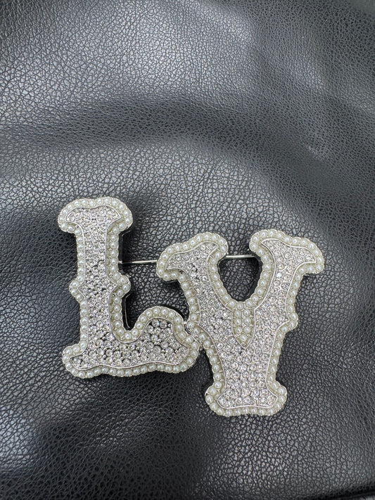 LV silver brooch