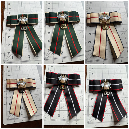 GG bow brooches