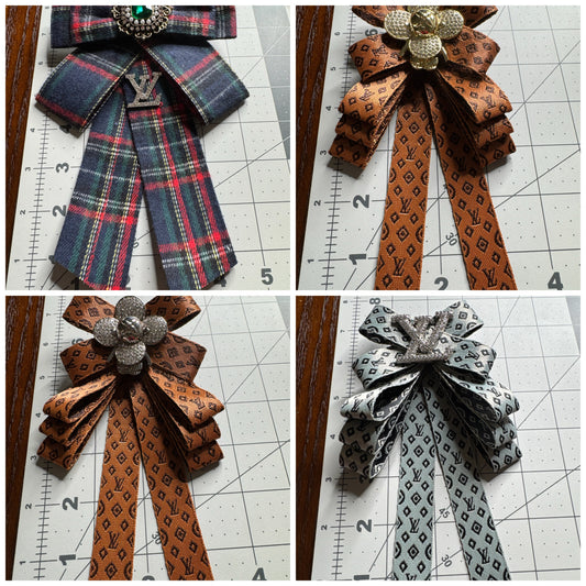 LV bows brooches